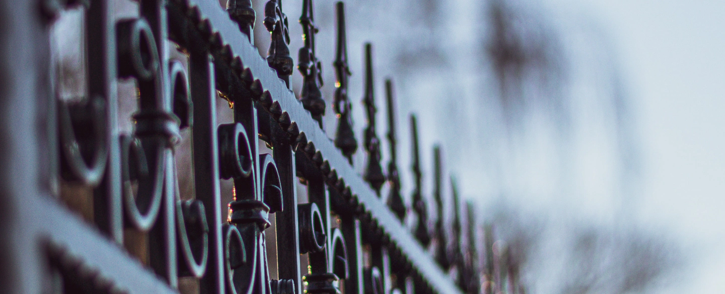 decorated iron fence with different ornaments
